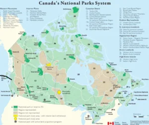 A detailed map of Canada highlighting the National Parks System. The map shows various regions, park locations, and labels indicating protected areas and park status. Key features include color-coded regions such as the Western Mountains and the Arctic Lowlands.