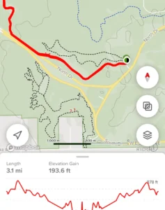 A detailed hiking trail map showing a 3.1-mile route with an elevation gain of 193.6 feet. The trail includes a figure resembling a rabbit and is marked in red. The map is oriented with North at the top.