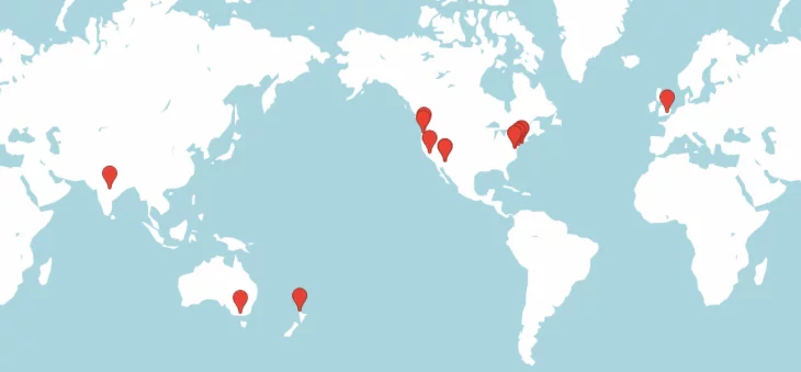 A world map with various locations marked by red pins, showcasing points primarily in North America, Europe, Asia, and Oceania.