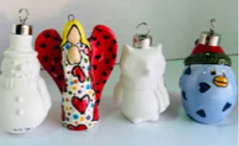 Four decorative ornaments displayed against a light background: a white snowman, a colorful angel with hearts, a plain white owl, and a blue bird with a red hat and yellow beak.