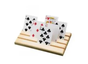 A set of playing cards arranged on a wooden surface. The cards feature various suits, including hearts, diamonds, clubs, and spades, with one card showing a king. The background is plain and light.