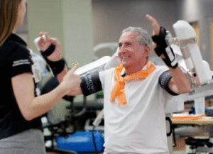 A man in a wheelchair receives help from a woman, showcasing an act of kindness and support.