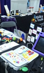 Add an exposition there’s a tabletop full of adaptive and assistive technology devices for disabled persons to use