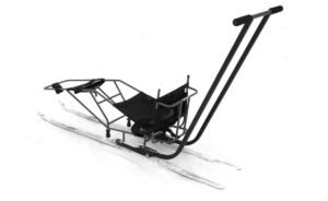A metal sled designed for cross-country skiing with a seating area and two long handles, suitable for accessible winter activities in Winnipeg.