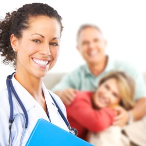 A female nurse smiling confidently in a medical setting, holding a clipboard. In the background, an older couple is seated together, embracing each other, suggesting a caring environment. The image represents the concept of elite nursing.