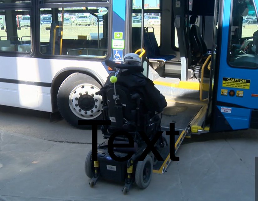 A man in a wheelchair boarding a bus using a designated accessibility ramp.