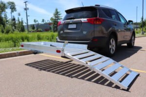 Aluminum lift and ramp attached to back of a mini van