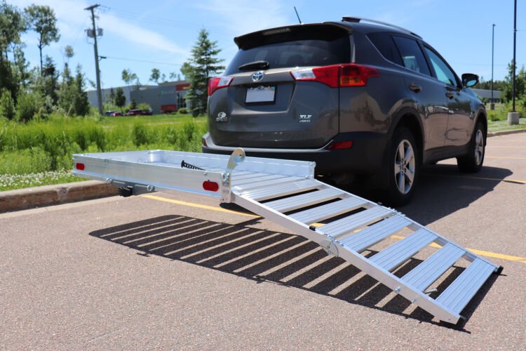 Aluminum lift and ramp attached to back of a mini van