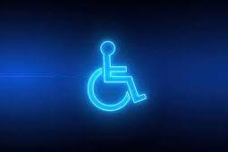 Wheelchair logo is blowing light blue against the dark blue and black background