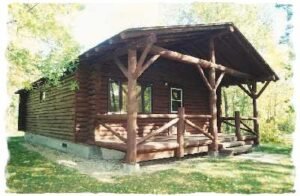 Rustic accessible wooden cabin set in the green Woods