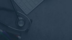 Against the dark blue gray background, you can see the outline of a telescope and a notepad