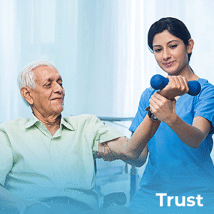 Senior gentlemen, seated in chair is being held with doing exercises by female healthcare.