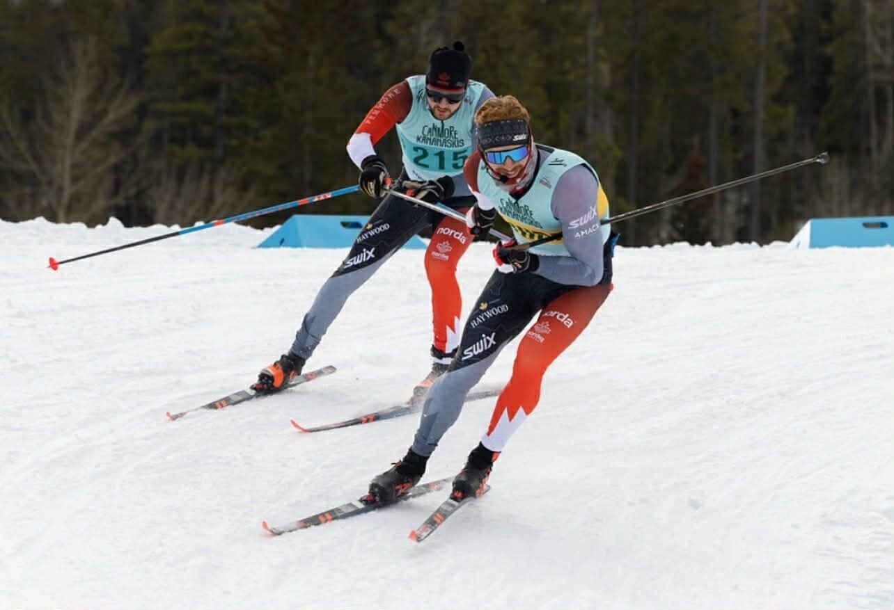 Two people skiing together